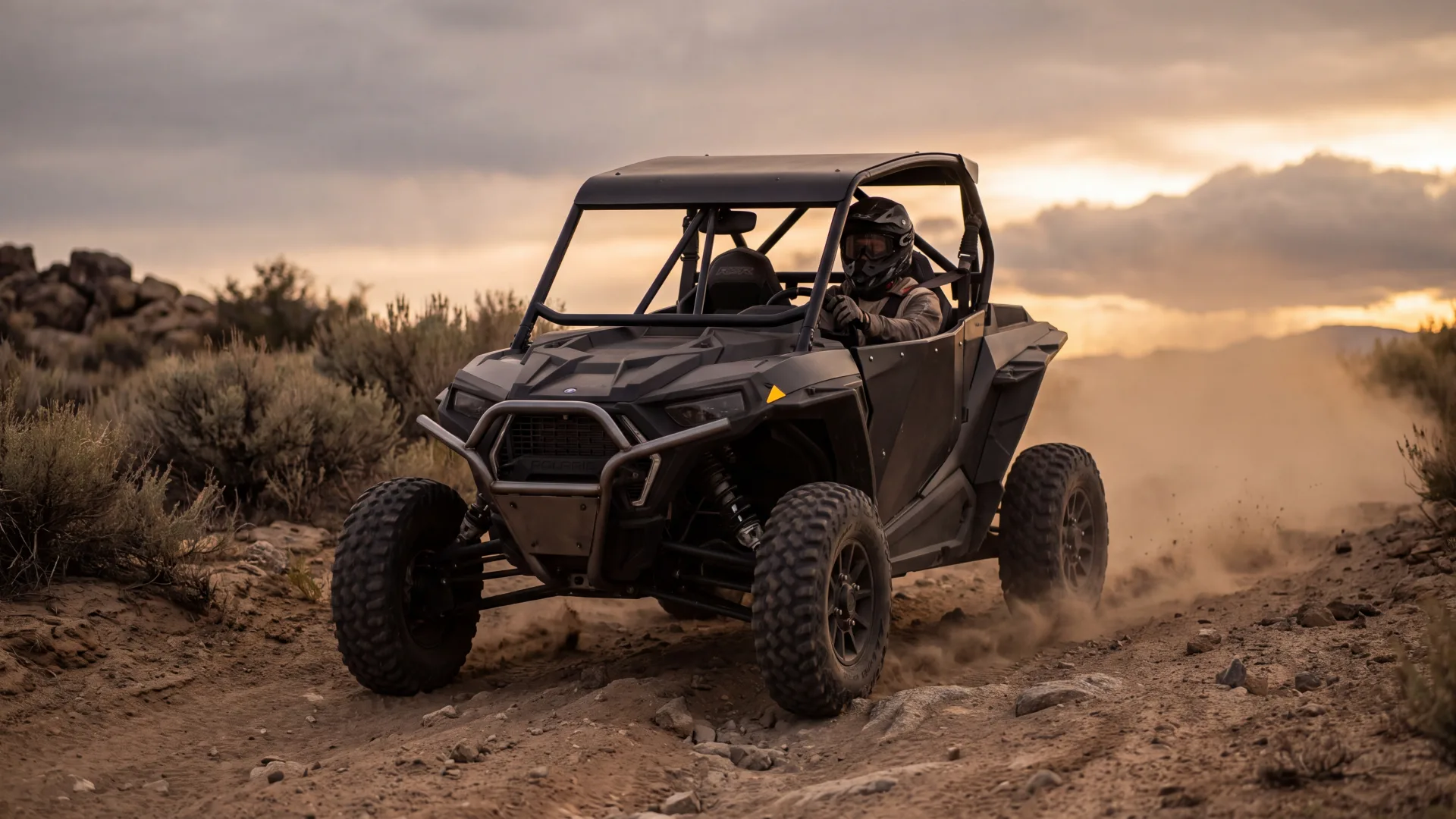 UTV tearing across a rugged off-road trail at golden hour